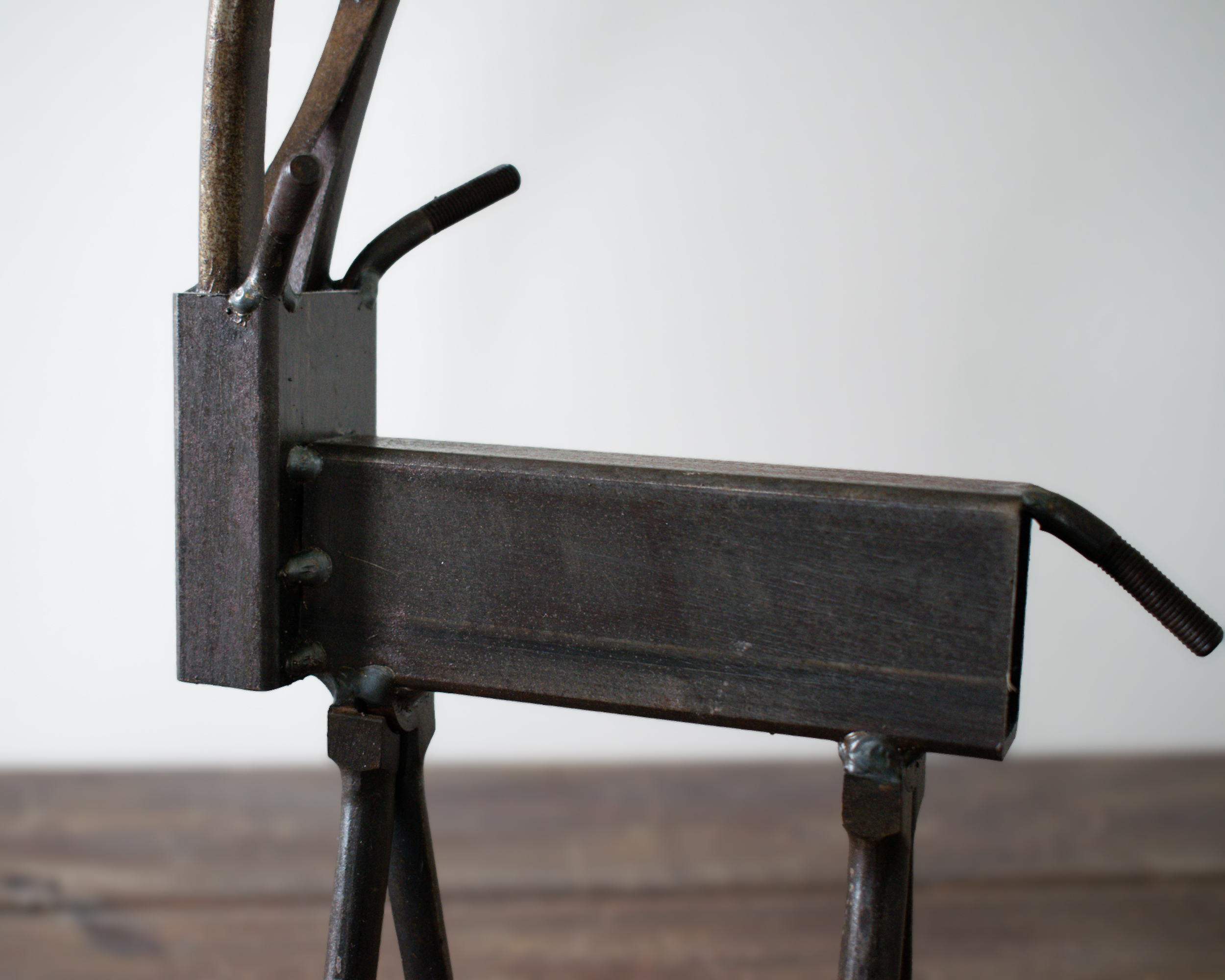 Close-up of welded metal antelope body made from rectangular steel tubing.
