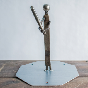 Metal baseball player sculpture made from a ball bearing, metal file, square-head nails, and steel base.