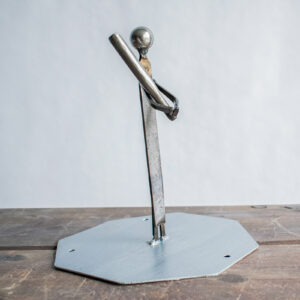 Side view of tabletop baseball decor showing a welded metal player holding a bat.