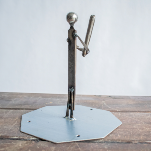 Back view of industrial baseball decor made from reclaimed steel and old shop materials.
