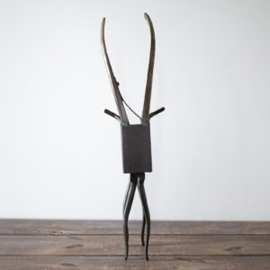 Welded metal antelope sculpture made from reclaimed steel, curved pliers, and rectangular tubing.