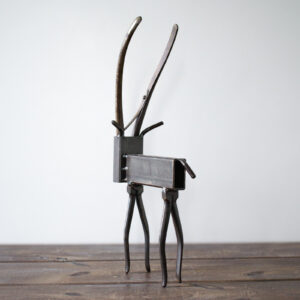 Back view of welded metal antelope sculpture made from steel tubing and reclaimed shop materials.