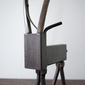 Close-up of the antelope head and curved plier horns on a reclaimed welded metal antelope sculpture.