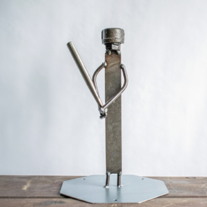 Metal baseball player sculpture made from a ball bearing, metal file, square-head nails, and reclaimed steel.