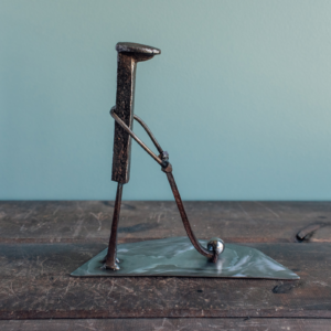 Side view of industrial golf decor made from reclaimed steel and old shop materials.