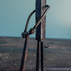 Close-up of welded arm and club detail on a reclaimed steel golfer sculpture.