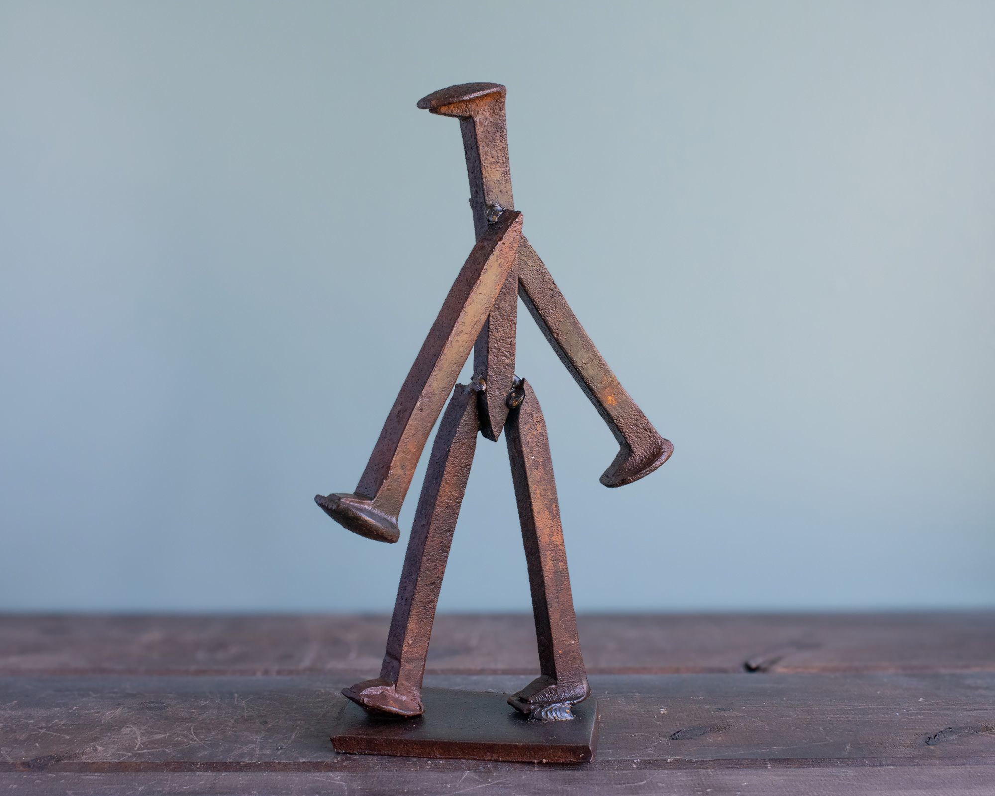 Side view of The Wandering Spike, a handmade metal sculpture made from reclaimed railroad spikes.